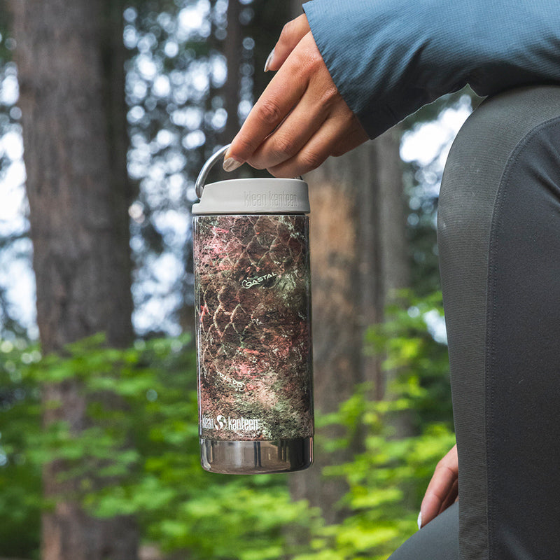 12oz-tkwide-with-twist-cap-mossy-oak-a6 12oz_tumbler_mossyoak_rainbowtrout_hand_closeup_square.jpg