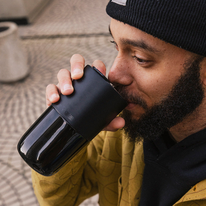 daily-on-the-go-set-y3 16oz_rise_tumbler_black_man_drink_square.jpg