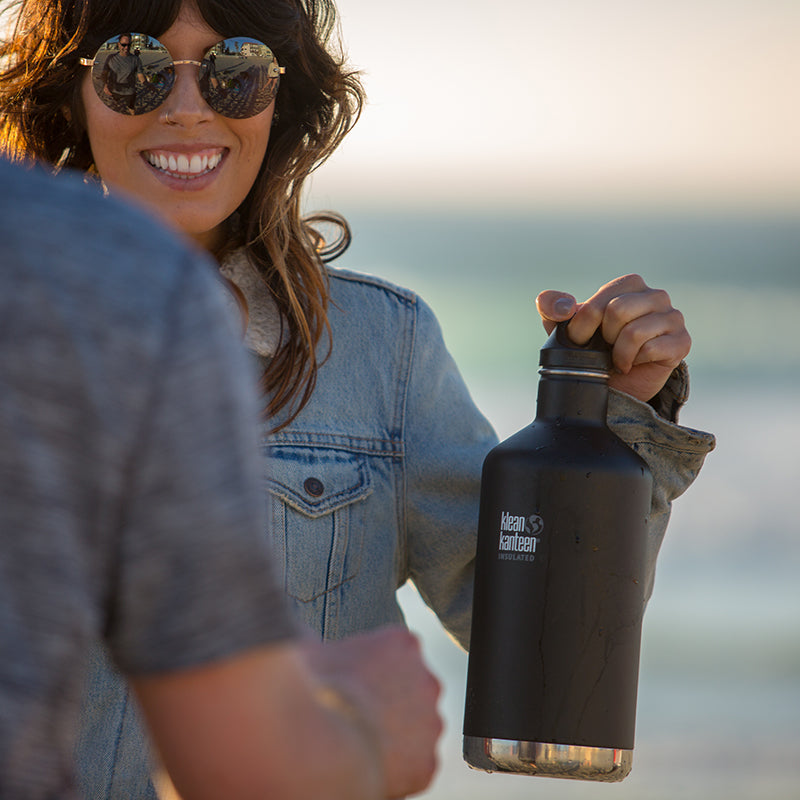 64oz-classic-with-loop-cap-r1 64oz_insulated_classic_black_beach_girl_hand_square.jpg